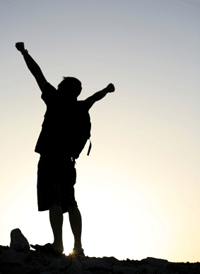 Guy Celebrates after Climbing a Mountain Guy Celebrates after Climbing a Mountain
