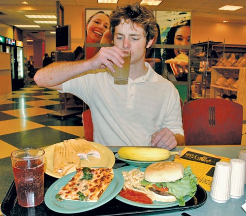 Student Eating at Cafeteria